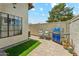 Serene backyard with a built-in grill, comfortable seating, and low-maintenance artificial turf at 11011 N 92Nd St # 1005, Scottsdale, AZ 85260
