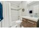 Well-lit bathroom featuring a shower, tub, toilet, and sink with modern fixtures at 11011 N 92Nd St # 1005, Scottsdale, AZ 85260