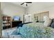 Cozy bedroom with ample space, ceiling fan, and closet at 11011 N 92Nd St # 1005, Scottsdale, AZ 85260