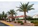 Beautiful community showcasing lush landscaping, palm trees, and charming residential architecture at 11011 N 92Nd St # 1005, Scottsdale, AZ 85260