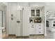 Updated kitchen with white cabinets, stainless steel refrigerator, and modern fixtures at 11011 N 92Nd St # 1005, Scottsdale, AZ 85260