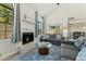 Inviting living room with a fireplace, large windows, vaulted ceiling, and comfortable seating area at 11011 N 92Nd St # 1005, Scottsdale, AZ 85260