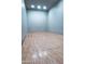 Interior view of a racquetball court with a hardwood floor and clean walls, providing a dedicated recreation space at 11011 N 92Nd St # 1005, Scottsdale, AZ 85260