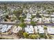 Expansive aerial view of a neighborhood featuring well-maintained homes, lush landscaping, and a community pool area at 113 E Boca Raton Rd, Phoenix, AZ 85022