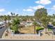 Aerial community view showcasing the meticulously landscaped grounds, palm trees, and a pristine pool area at 113 E Boca Raton Rd, Phoenix, AZ 85022