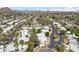 Neighborhood aerial showcasing neatly arranged homes, winding streets, and desert landscaping against a mountain backdrop at 113 E Boca Raton Rd, Phoenix, AZ 85022