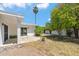 White backyard featuring desert landscaping and a concrete patio at 113 E Boca Raton Rd, Phoenix, AZ 85022