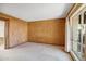 Bedroom featuring a large window, natural light, and neutral carpeting at 113 E Boca Raton Rd, Phoenix, AZ 85022