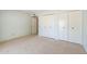 Bright bedroom featuring neutral carpet and large closets for ample storage space at 113 E Boca Raton Rd, Phoenix, AZ 85022