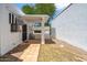 Charming courtyard entrance with tiled patio and decorative gate at 113 E Boca Raton Rd, Phoenix, AZ 85022