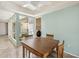 Casual dining area with a view to outside, featuring a wooden table and a ceiling fan at 113 E Boca Raton Rd, Phoenix, AZ 85022