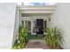 Inviting front entry featuring desert landscaping and a secure wrought iron gate at 113 E Boca Raton Rd, Phoenix, AZ 85022