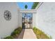 Attractive entry gate with well-maintained landscaping and desert accents at 113 E Boca Raton Rd, Phoenix, AZ 85022