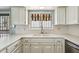 Bright kitchen featuring white cabinets, quartz countertops, and a stainless steel sink at 113 E Boca Raton Rd, Phoenix, AZ 85022