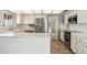 Modern kitchen with stainless steel appliances, white countertops, and ample cabinet space at 113 E Boca Raton Rd, Phoenix, AZ 85022