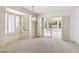 Bright living room with sliding doors, window shutters, and chandelier at 113 E Boca Raton Rd, Phoenix, AZ 85022