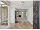 Open living room view from the foyer, showcasing a fireplace and neutral carpeting at 113 E Boca Raton Rd, Phoenix, AZ 85022