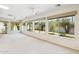 Bright living room with large windows offering views of the landscaped backyard at 113 E Boca Raton Rd, Phoenix, AZ 85022