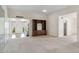 Spacious living room with built in shelving and seamless flow to other rooms at 113 E Boca Raton Rd, Phoenix, AZ 85022