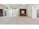 Spacious living room with built in shelving and seamless flow to other rooms at 113 E Boca Raton Rd, Phoenix, AZ 85022