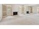 Bright living room with fireplace, access to the backyard, and mirror wall at 113 E Boca Raton Rd, Phoenix, AZ 85022