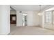 Living room with chandelier, seamless flow, and view of hallway and adjacent room at 113 E Boca Raton Rd, Phoenix, AZ 85022