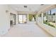 Sun room with large windows, and sliding doors to the backyard and patio at 113 E Boca Raton Rd, Phoenix, AZ 85022