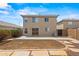 Exterior view of the back of the house with a backyard at 11710 W Paradise Dr, El Mirage, AZ 85335