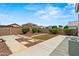 Backyard with block wall and rock landscaping at 11710 W Paradise Dr, El Mirage, AZ 85335
