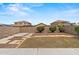 A clean backyard featuring a lawn and rock at 11710 W Paradise Dr, El Mirage, AZ 85335