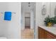 Bathroom with tile flooring, wood vanity, and mirrored wall cabinet at 11710 W Paradise Dr, El Mirage, AZ 85335