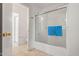 Bright bathroom with glass-enclosed shower and tile flooring at 11710 W Paradise Dr, El Mirage, AZ 85335