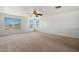 Large bedroom with multiple windows providing ample natural light and ceiling fan at 11710 W Paradise Dr, El Mirage, AZ 85335