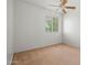Cozy bedroom featuring a neutral carpet, one window, and ceiling fan at 11710 W Paradise Dr, El Mirage, AZ 85335