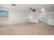 Spacious upper level bonus room with neutral carpet, bright window, and lots of open space at 11710 W Paradise Dr, El Mirage, AZ 85335