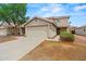 Charming two-story home featuring a neutral color palette, a two car garage, and low-maintenance landscaping at 11710 W Paradise Dr, El Mirage, AZ 85335