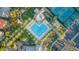 Aerial view showcasing a resort-style pool, tennis courts, and lush landscaping, ideal for recreation and relaxation at 11993 E Mission Ln, Scottsdale, AZ 85259