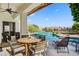 Outdoor seating area offers views of the pool, patio, and landscaping, perfect for enjoying the Arizona weather at 11993 E Mission Ln, Scottsdale, AZ 85259