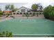 Outdoor basketball court with green surface surrounded by desert landscaping, enhancing community recreation at 11993 E Mission Ln, Scottsdale, AZ 85259