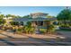 Community center featuring lush greenery, a tranquil water feature, and a welcoming entrance at 11993 E Mission Ln, Scottsdale, AZ 85259