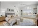 Bright main bedroom with hardwood floors, neutral tones, stylish decor, and comfortable furnishings for a relaxing retreat at 11993 E Mission Ln, Scottsdale, AZ 85259