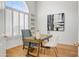 Well-lit home office with custom built-ins, wood floors, decorative window, and contemporary furnishings for a productive space at 11993 E Mission Ln, Scottsdale, AZ 85259