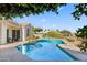 Backyard pool surrounded by desert landscaping and greenery, perfect for relaxation and enjoying the outdoors at 11993 E Mission Ln, Scottsdale, AZ 85259