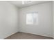 Cozy bedroom with neutral carpet, a window, and fresh paint at 12355 W Hadley St, Avondale, AZ 85323