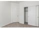 Neutral bedroom featuring closet with sliding doors and fresh paint at 12355 W Hadley St, Avondale, AZ 85323