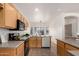 View of the kitchen showcasing the wood cabinets and tile flooring at 12355 W Hadley St, Avondale, AZ 85323