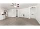 Neutral color living room area with carpet flooring and access to several areas of the home at 12355 W Hadley St, Avondale, AZ 85323