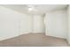 Spacious primary bedroom with carpet and access to the en suite bathroom at 12355 W Hadley St, Avondale, AZ 85323