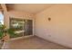 Covered outdoor patio area with sliding glass doors leading to the backyard at 12355 W Hadley St, Avondale, AZ 85323