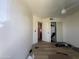 Neutral bedroom featuring wood floor, ceiling fan, and closet at 12938 W Alvarado Rd, Avondale, AZ 85392